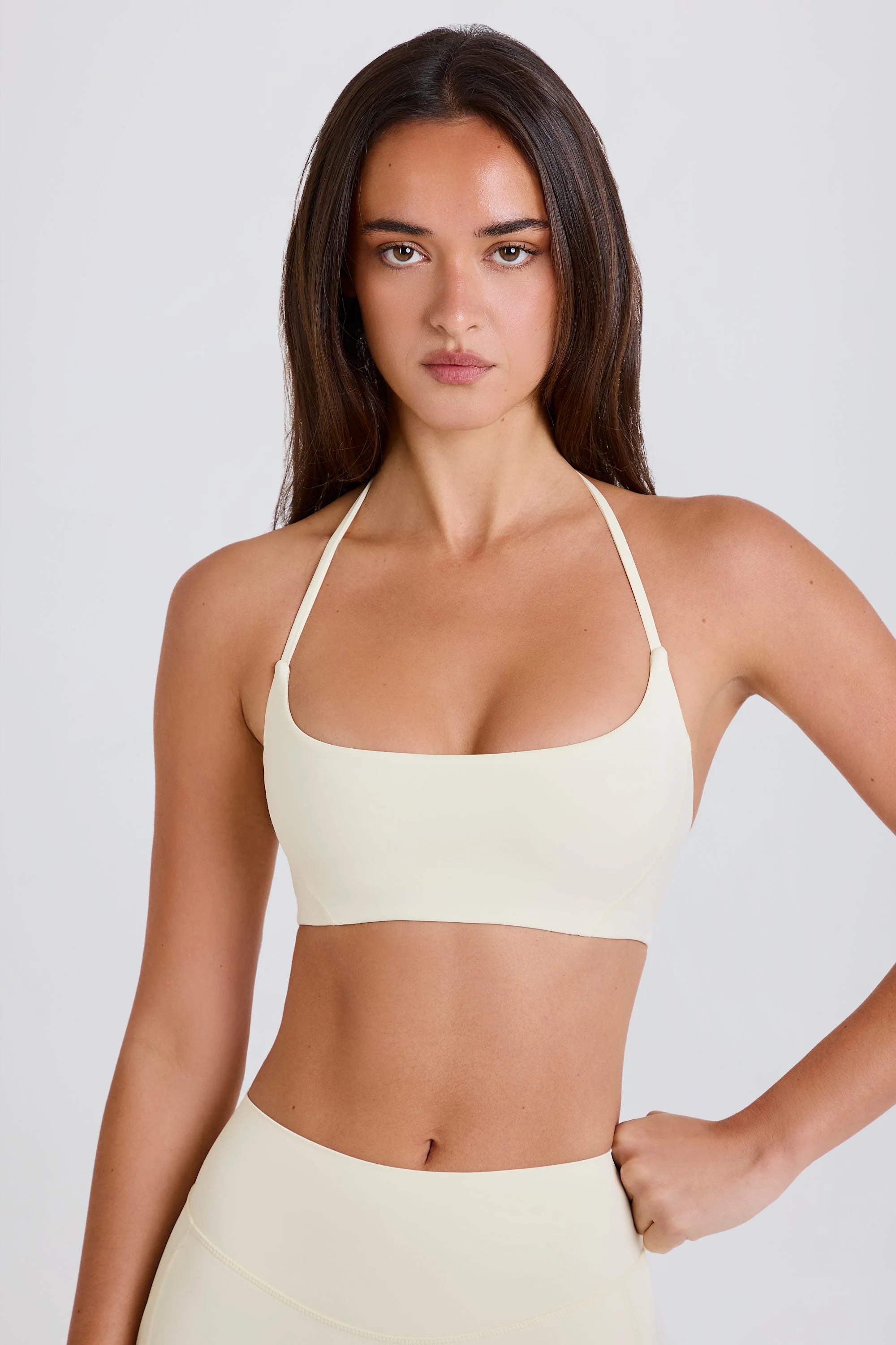 Solid Scoop-Neck Halterneck Sports Bra in Cream Contemporary